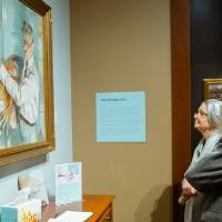 Guests admiring paintings at Friends of Alten 2018